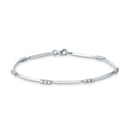 Bracciale Mirco Visconti in oro bianco 18kt con barrette lisce e gruppi di tre diamanti, chiusura a moschettone